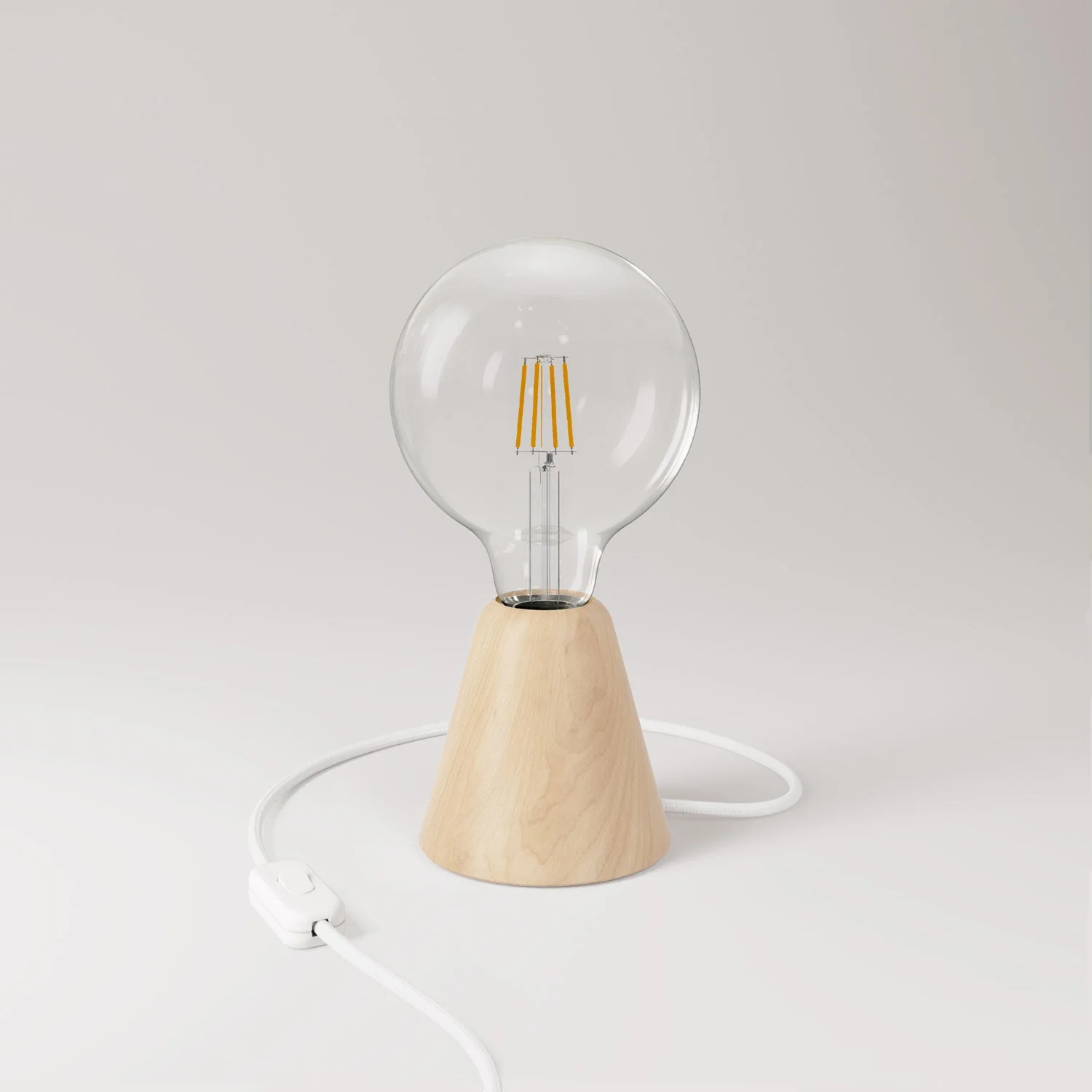 Table lamp with alder wood base, transparent light bulb, RM01 cable and EU plug.